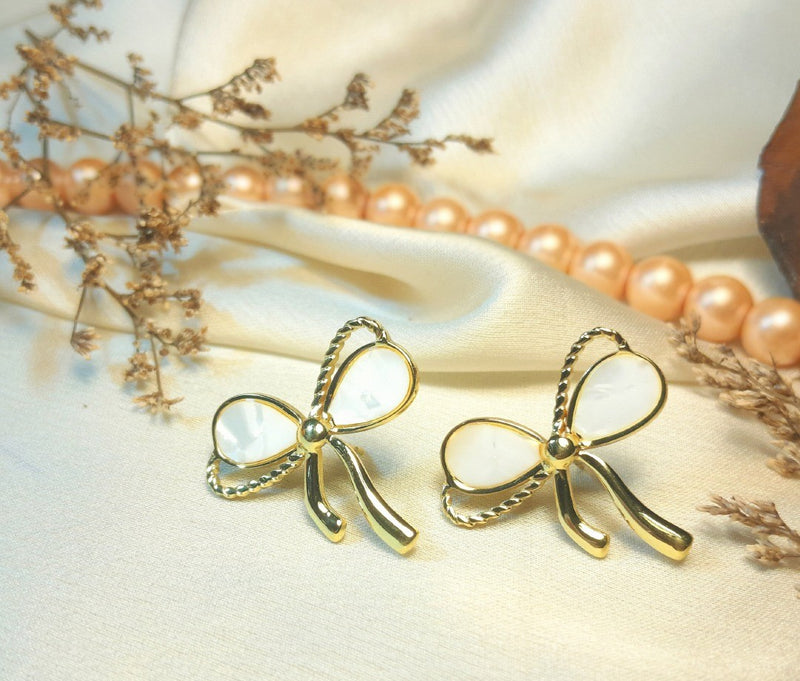 Golden white stone bow tie earrings