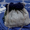 Crocheted rose potli bag