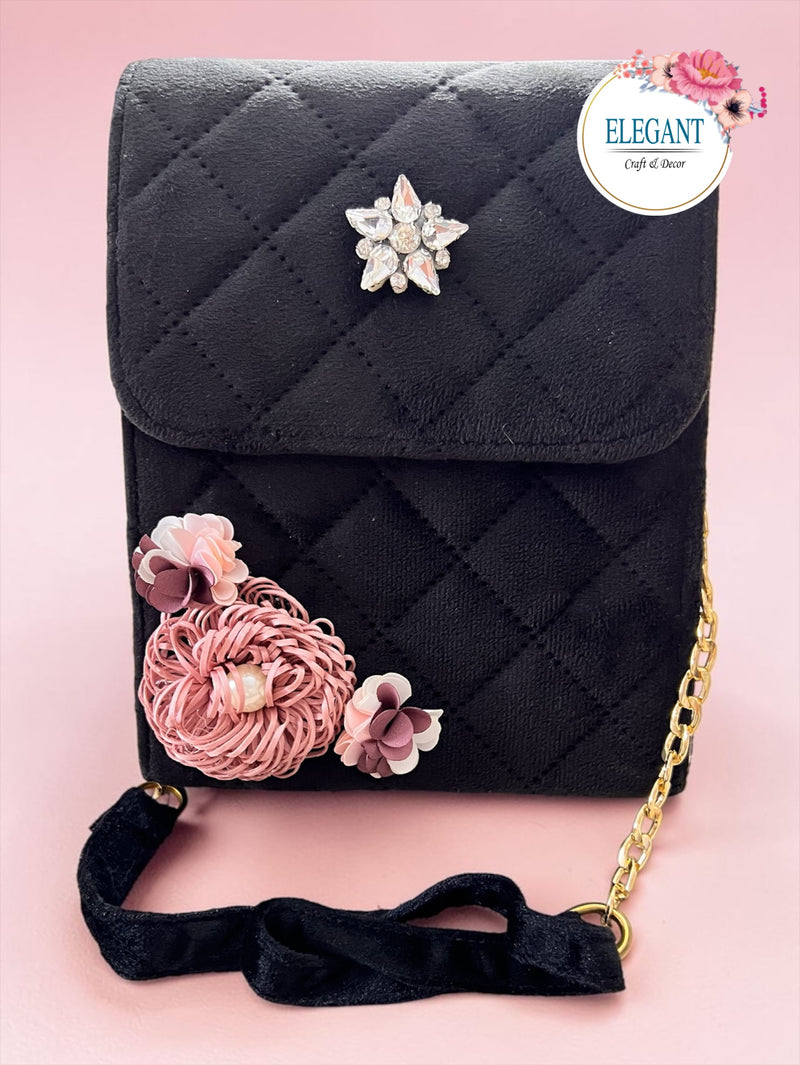 Elegant suede purse with long metal chain and metal embellishment with a touch of floral bunch