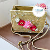 Beige woven box bag features vibrant 3D flowers and delicate embroidery. It includes a matching adjustable strap, making it a stylish and versatile accessory for any special occasion.