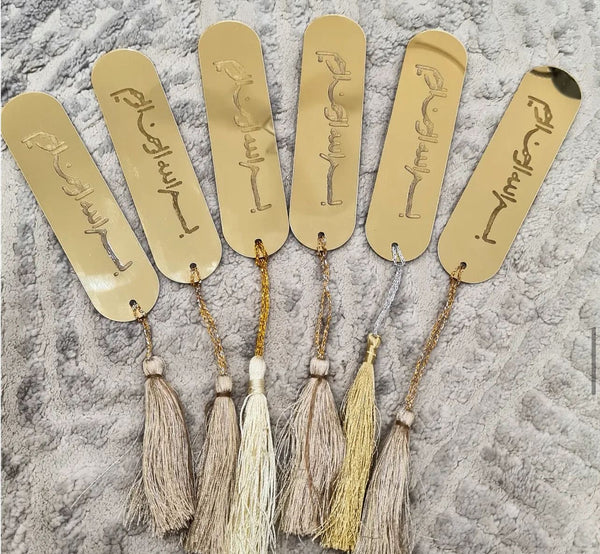 bookmark: gold acrylic bookmark along with a tassel